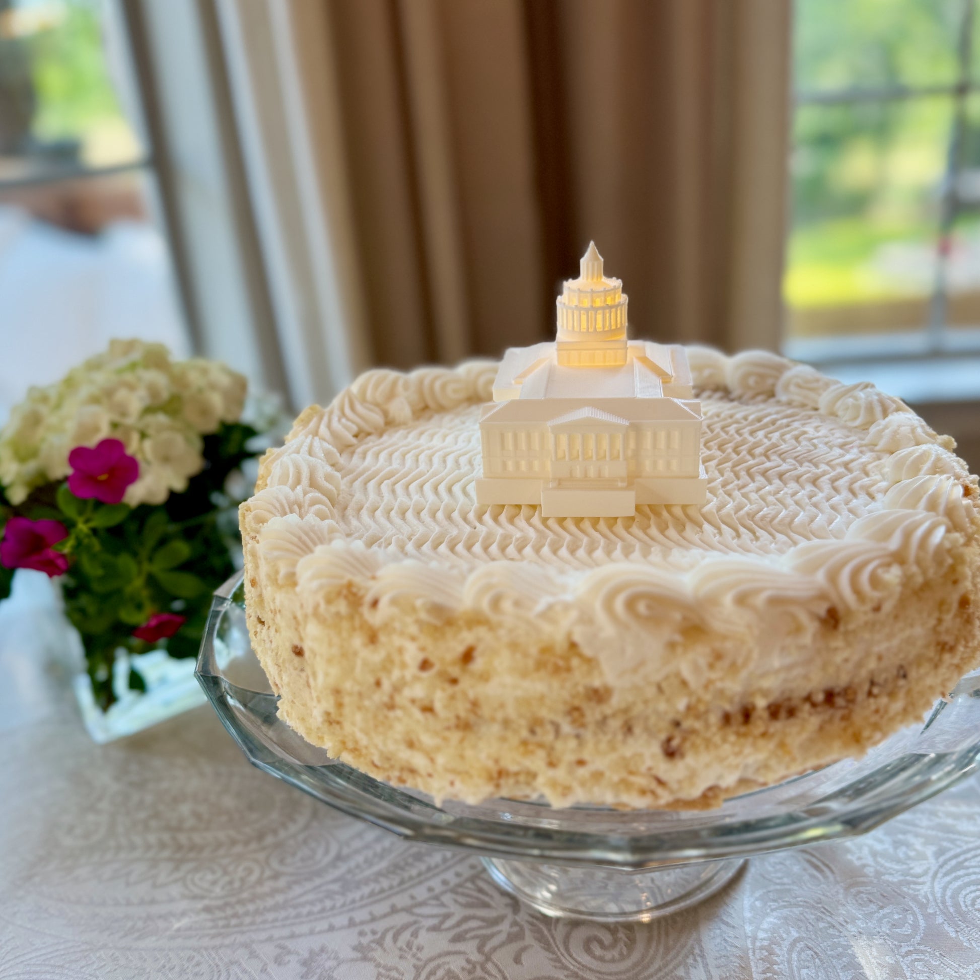 The University of Rochester Rush Rheese Library figurine, used as a cake topper on a graduation cake.