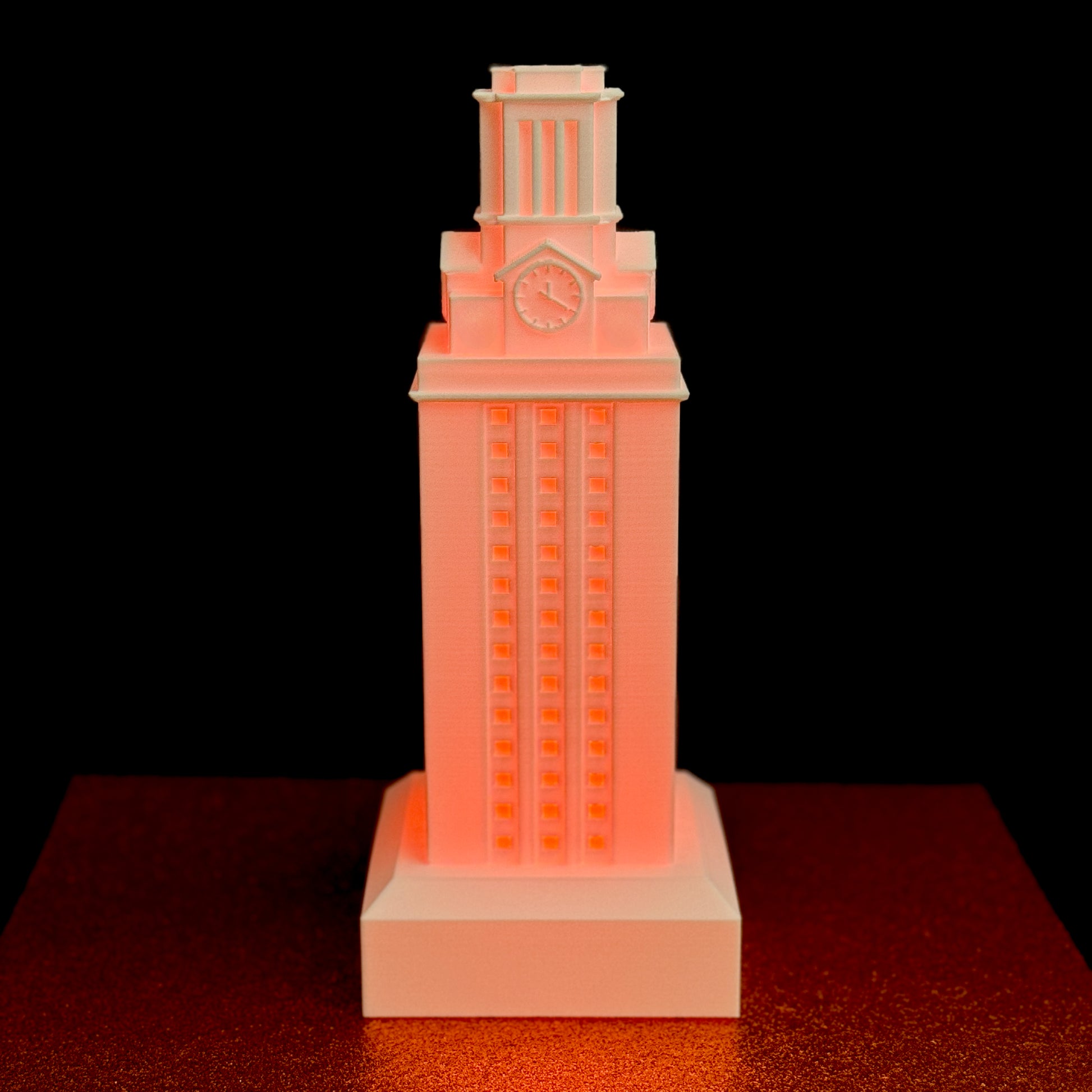A University of Texas gift for a Longhorn student, a large UT Tower figurine with a burnt orange light.