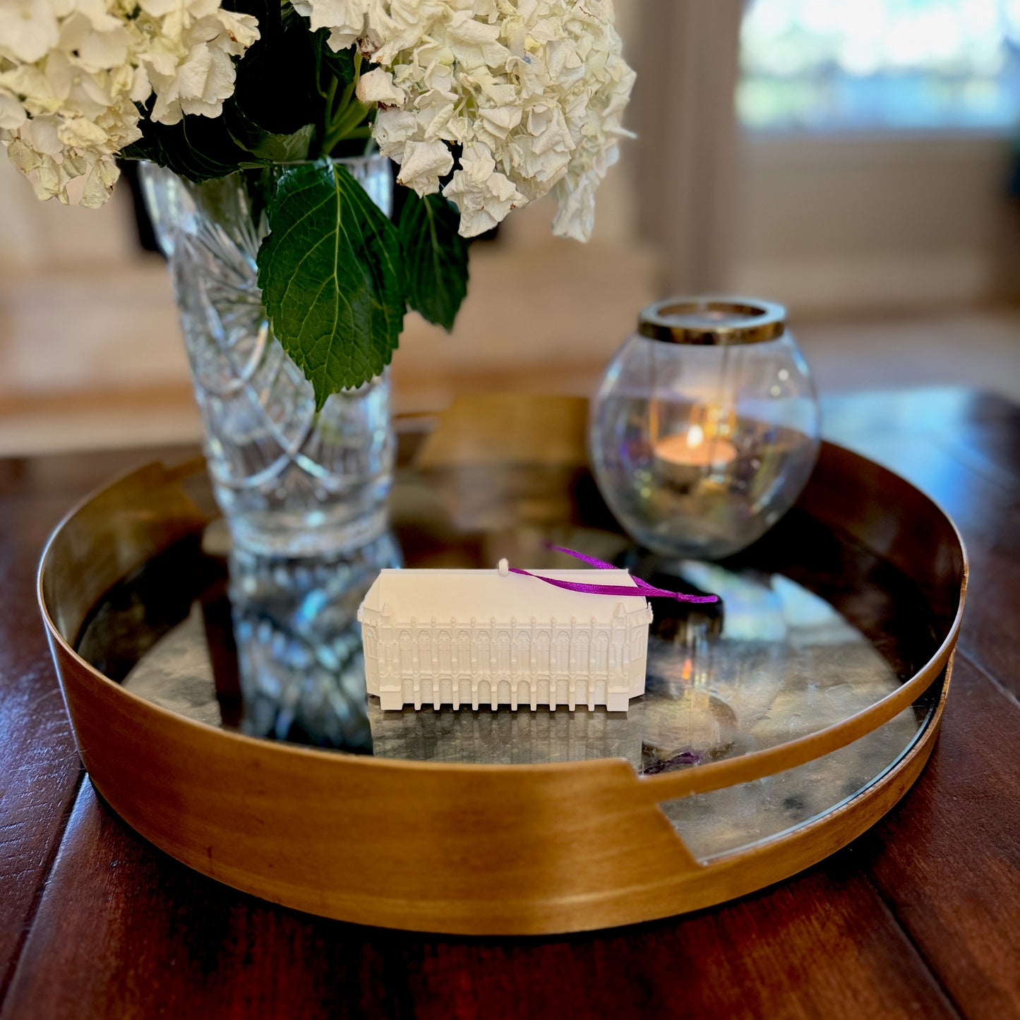The University of Washington ornament shown in a home decorated for the holidays.