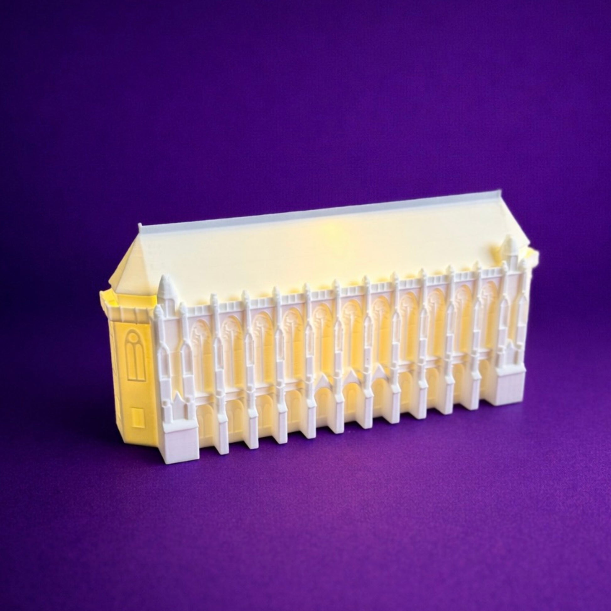The University of Washington figurine designed to be used as a graduation gift, alumni gift, or party decoration.