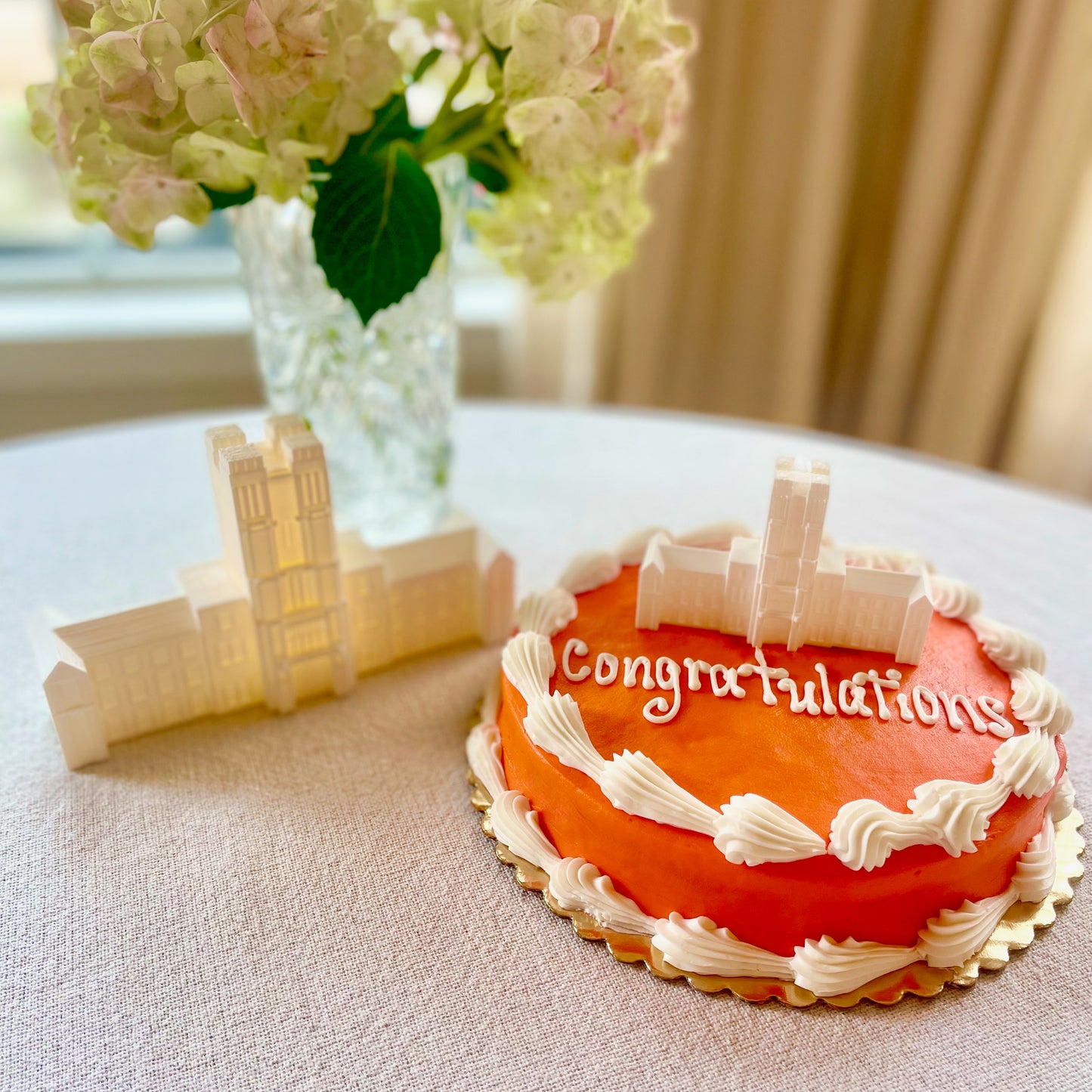 Virginia Tech Cake Toppers and Party Decor designed as the Burruss Hall building and shown at a graduation party or wedding.