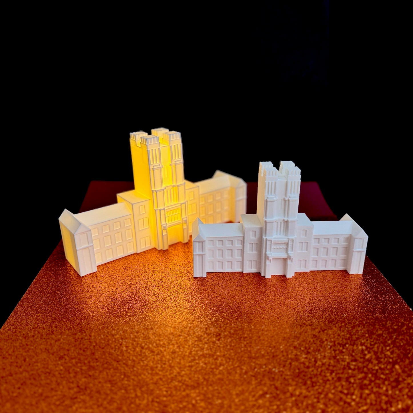 Virginia Tech alumni decor showing two Burruss Hall models in different sizes