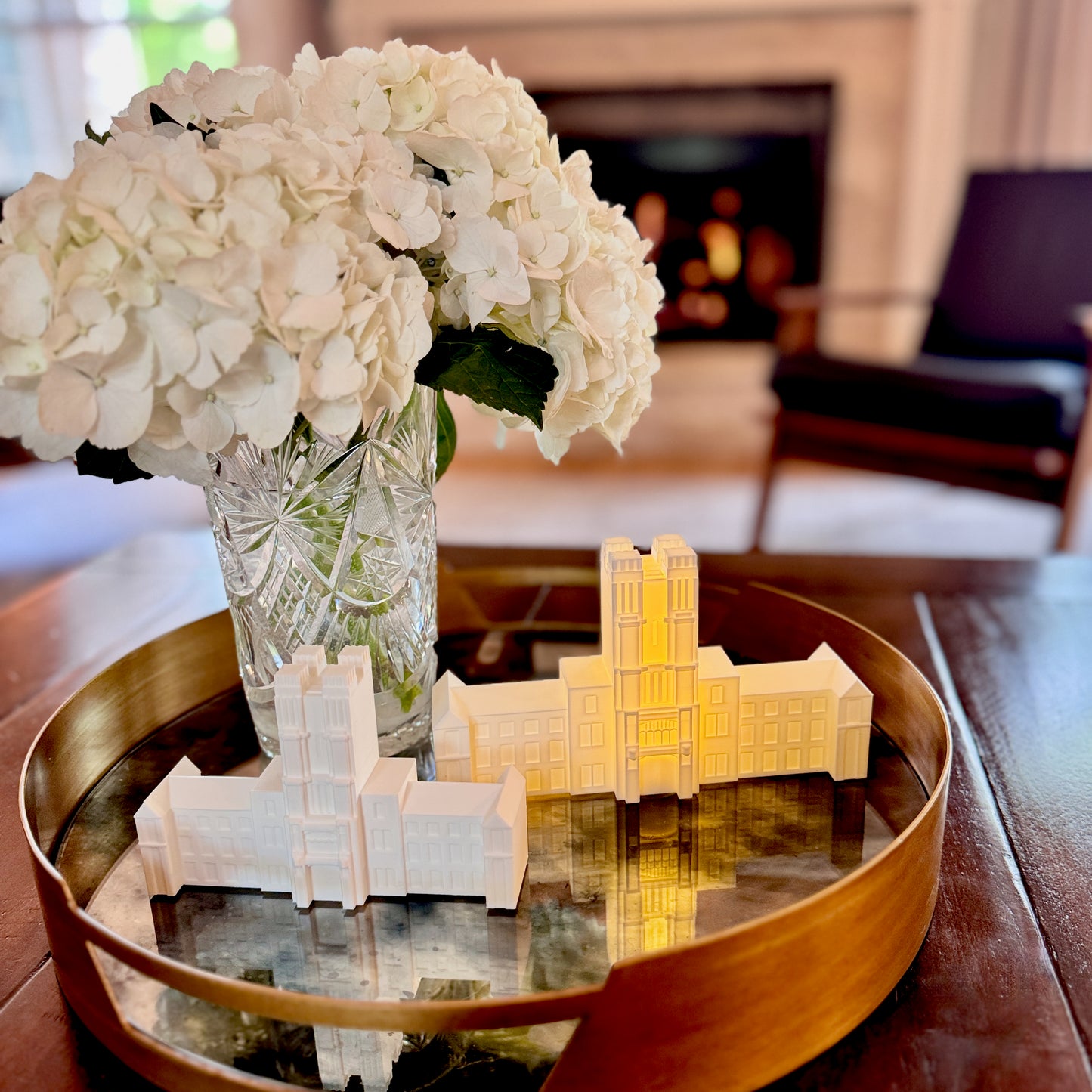 Virginia Tech figurines of Burruss Hall shown in use as home decor.