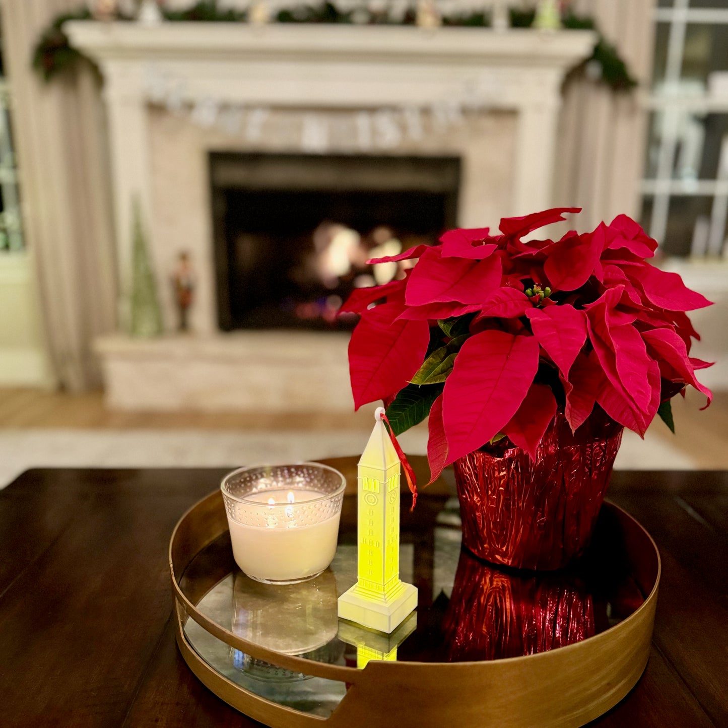 The Cornell University ornament with a light, shown in a home decorated for the holidays.