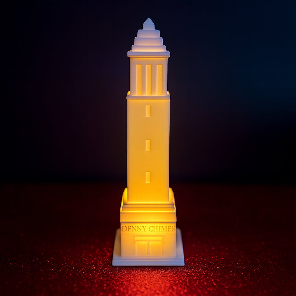 LED-lit 3D printed Denny Chimes tower figurine on a red textured surface with a dark gradient background.