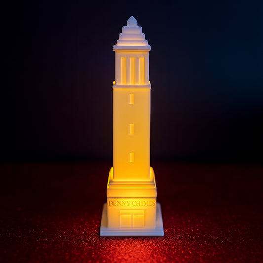 LED-lit 3D printed Denny Chimes tower figurine on a red textured surface with a dark gradient background.