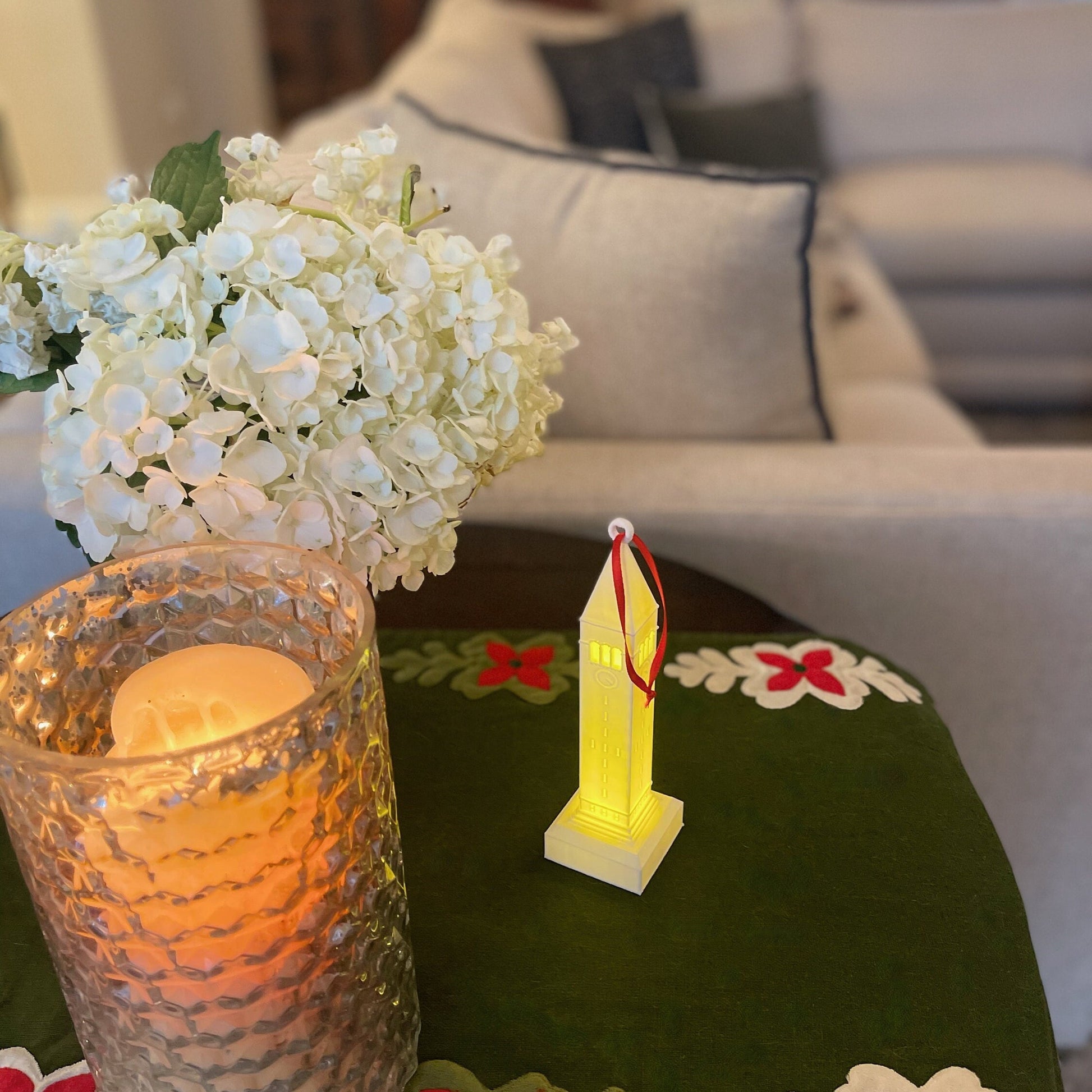 The lighted Cornell ornament, shown in a home decorated for the holidays.