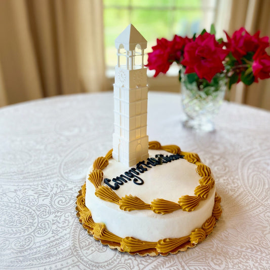 The lighted Purdue cake topper, shown on a Purdue graduation cake.