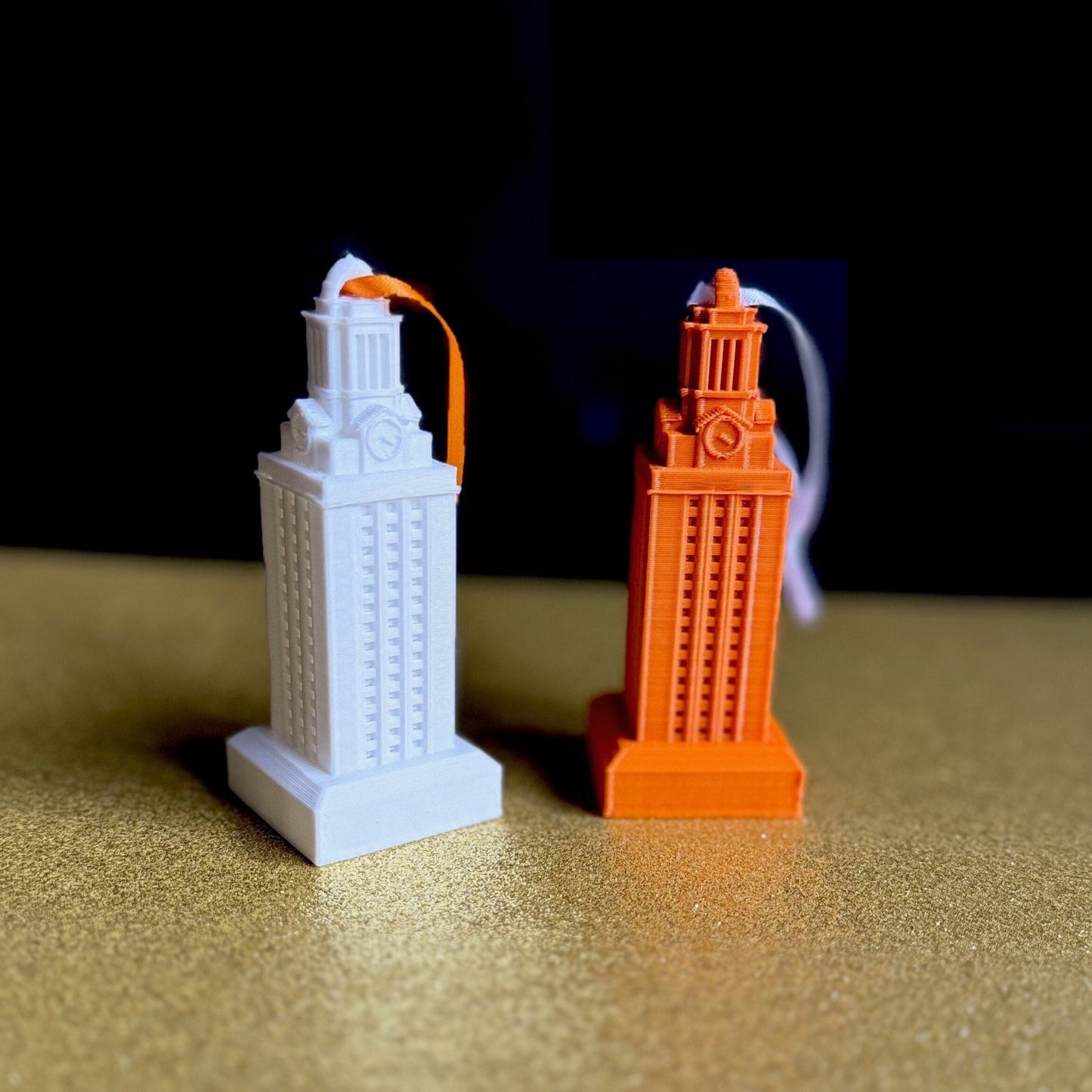 The UT Tower ornaments, shown in white and burnt orange.