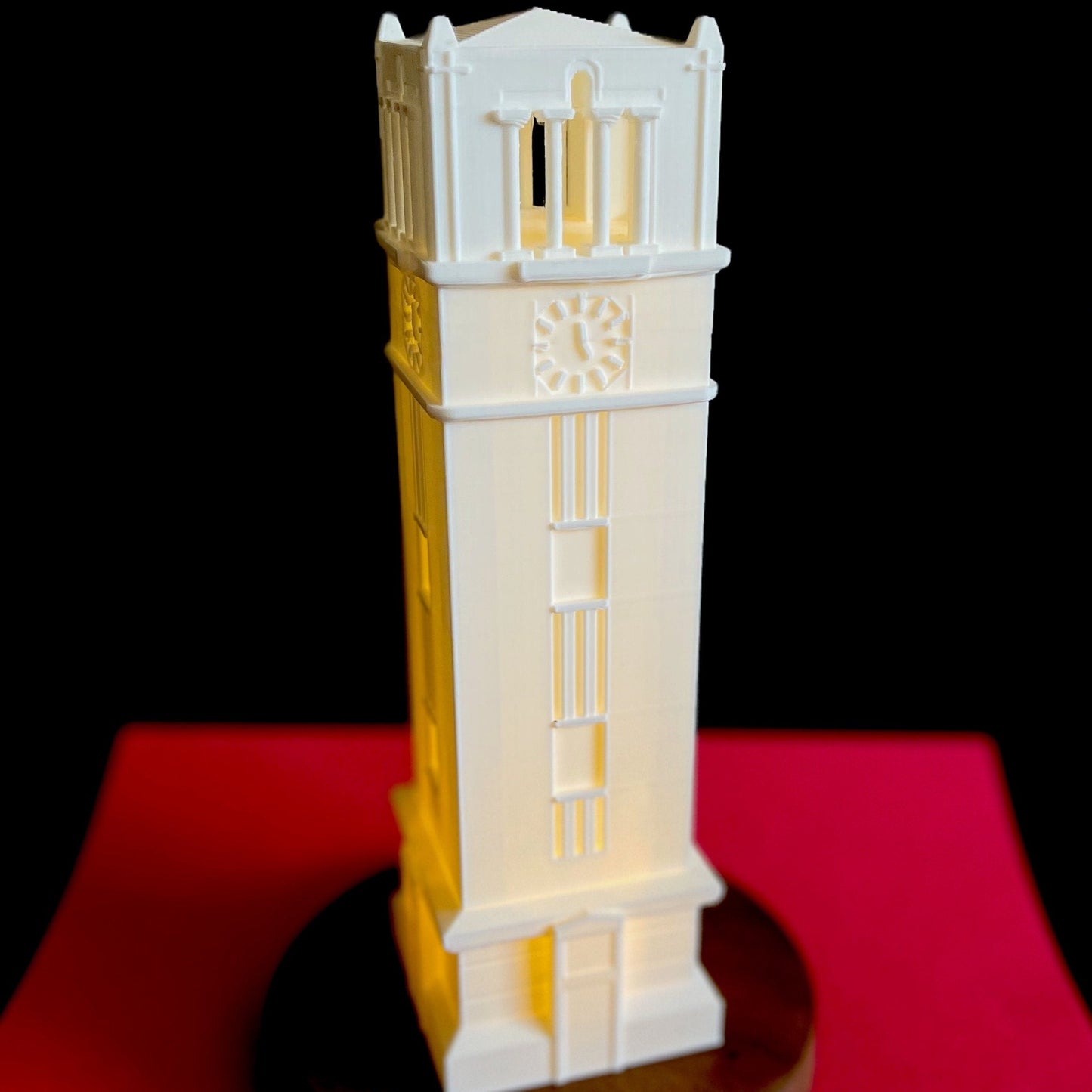 The NC State lamp, shown in a soft white light.